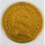 An 1803 George III third guinea gold coin approx.