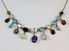 A c.1900 yellow metal necklace set with topaz, whi