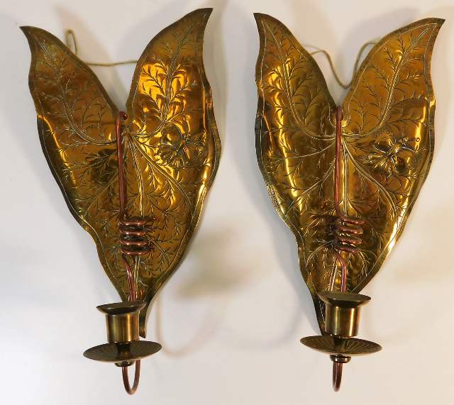 A pair of Victorian copper wall sconces with relie