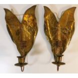 A pair of Victorian copper wall sconces with relie
