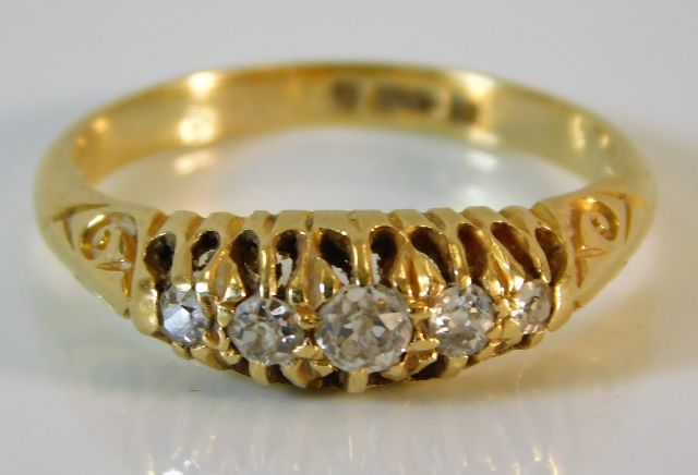 An antique 18ct gold five stone diamond ring appro