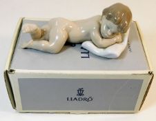 A boxed Lladro porcelain figure of baby with pillo