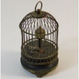 A miniature automaton bird cage clock