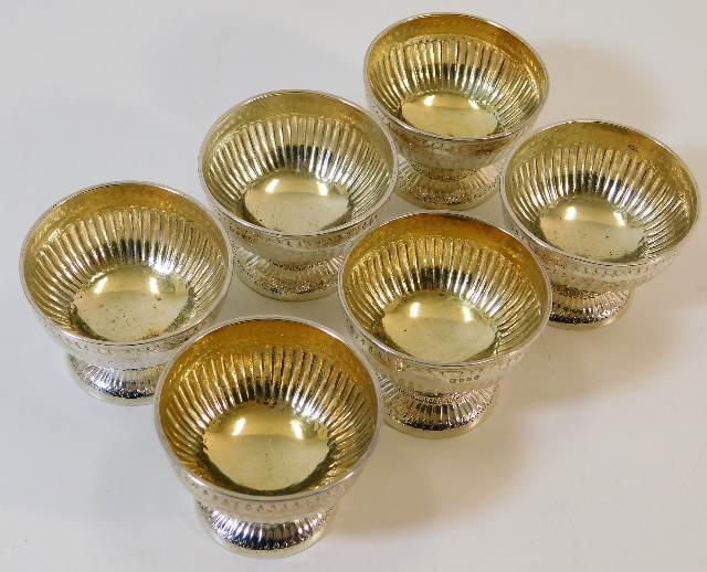 A set of six London silver footed bowls with gadro