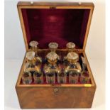 A gilded six bottle Regency period decanter set wi