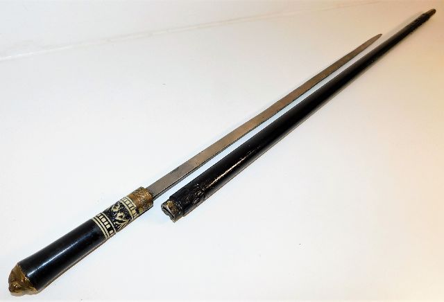 A gents sword stick walking cane with inlaid bone