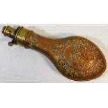A 19thC. copper powder flask with embossed horse d