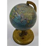 A vintage 1950's tinplate globe 8in high