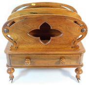 A Victorian walnut Canterbury with drawer under on