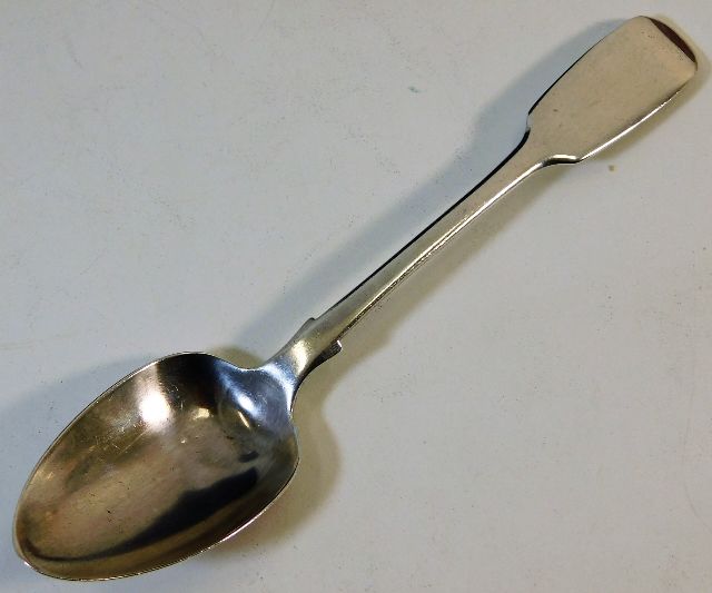 A silver fiddle pattern spoon 33.9g 1857 Samuel Wh