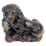 A 18th/19thC. cast iron lion with ball 8.25in long