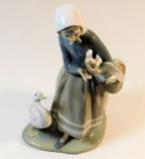 A Lladro porcelain figure of woman with goose 9in