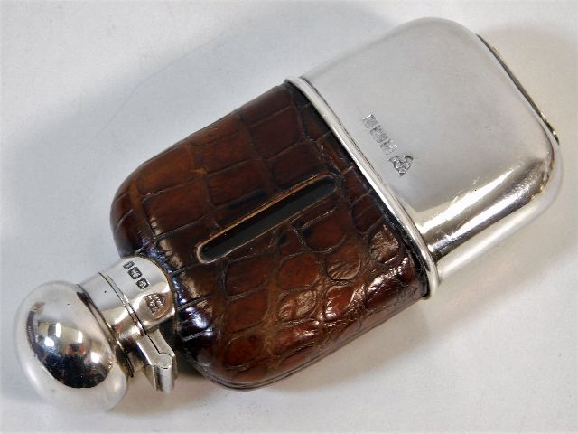 A 1910 silver mounted hip flask by G & J W Hawksle