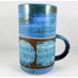 A Troika pottery mug indistinct mark, possibly Jan