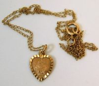 A 9ct gold chain with heart shaped St. Christopher