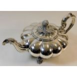 An early 19thC. silver teapot of lobbed form with