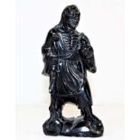 An antique Chinese carved black jade figure, chip