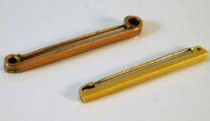 A 15ct bar brooch 3.4g twinned with a 9ct gold bro