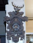 A mid 20thC. black forest cuckoo clock with stag &