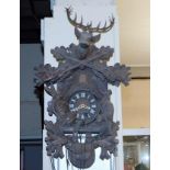 A mid 20thC. black forest cuckoo clock with stag &