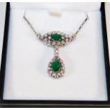 An 18ct white gold mounted emerald & diamond neckl