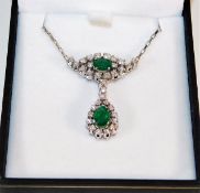 An 18ct white gold mounted emerald & diamond neckl