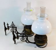 A pair of decorative of 19thC. French wall mounted church oil lamps with shades & chimneys depth 15.