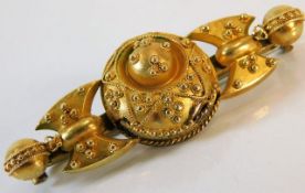 An Edwardian yellow metal brooch inscribed I.M.S 1