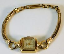 A ladies wristwatch with 14ct gold case & plated s
