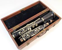 A cased E. J. Albert Brussels clarinet