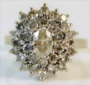 An 18ct white gold diamond cluster ring of approx.