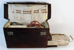 A vintage midwifery case with contents