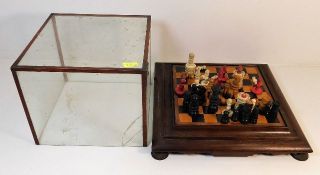 A 19thC. 12in square chess table with glass cover,