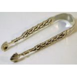 A pair of Georgian silver sugar tongs with lattice