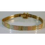 A 9ct gold three colour bracelet 12.2g