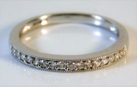 A 9ct white gold half eternity ring with 0.17ct di
