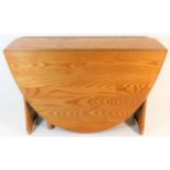 An Ercol elm retro tyle sutherland table 27.5in wi