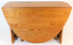 An Ercol elm retro tyle sutherland table 27.5in wi