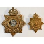 A West Surrey helmet badge twinned with one other