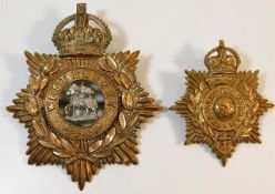 A West Surrey helmet badge twinned with one other