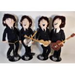 A 1980's novelty Beatles band with stands 21in hig