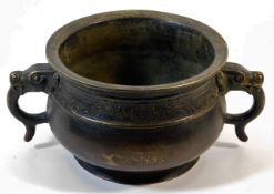 A Chinese bronze two handled censer bowl with chas