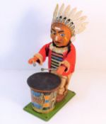 A tin plate Native American drummer toy
