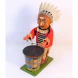 A tin plate Native American drummer toy