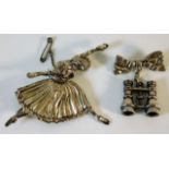 A silver dancer brooch twinned with a silver bow &