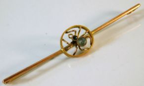 An antique 9ct gold spider brooch set with possibl