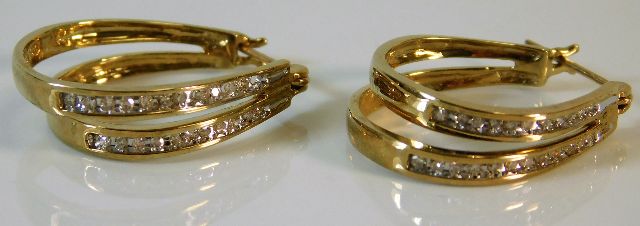 A pair of 9ct gold double hooped diamond set earri