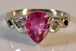 An 18ct white gold ring set with diamond & pink sa