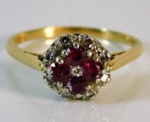 An 18ct gold diamond & ruby ring 3.7g size R/S