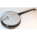 A vintage banjo, some losses to strings